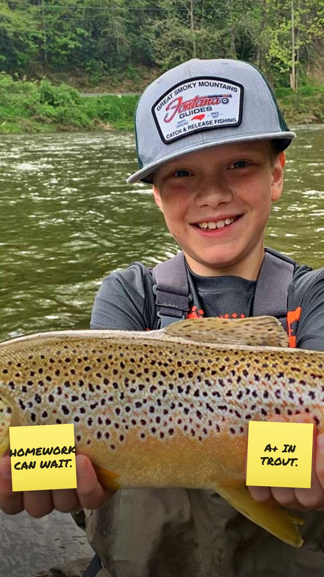 Ad: kid with a brown trout and sticky notes homework can wait a plus in trout (vertical version)