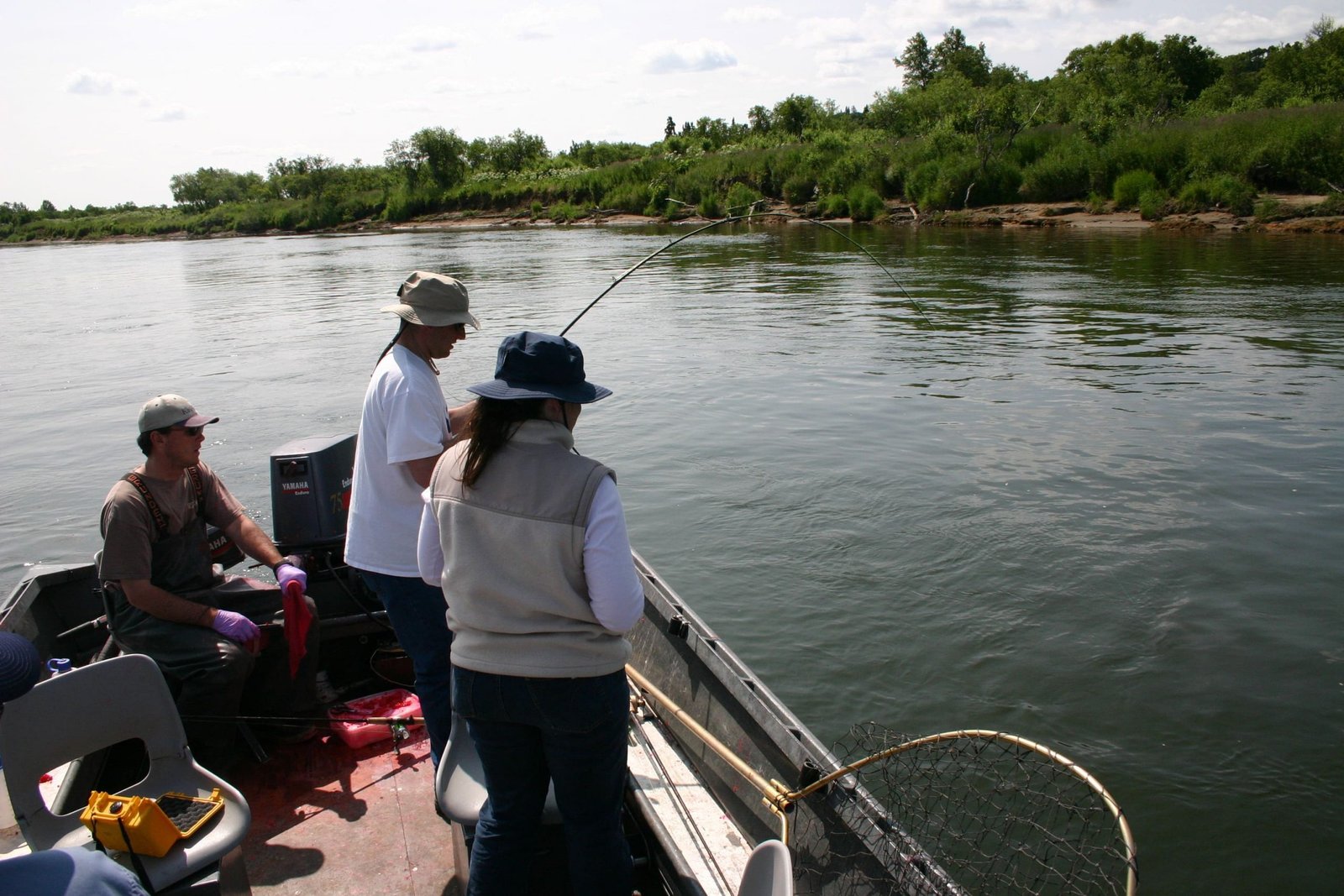 A guide working with a client on the water, photographed by Alaska Kingfishers in AK