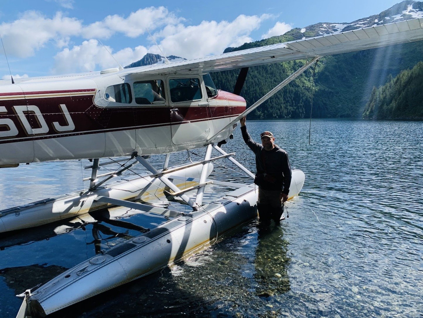 A guide working with a client on the water, photographed by Alaskan Adventure Guides and Outfitters in AK