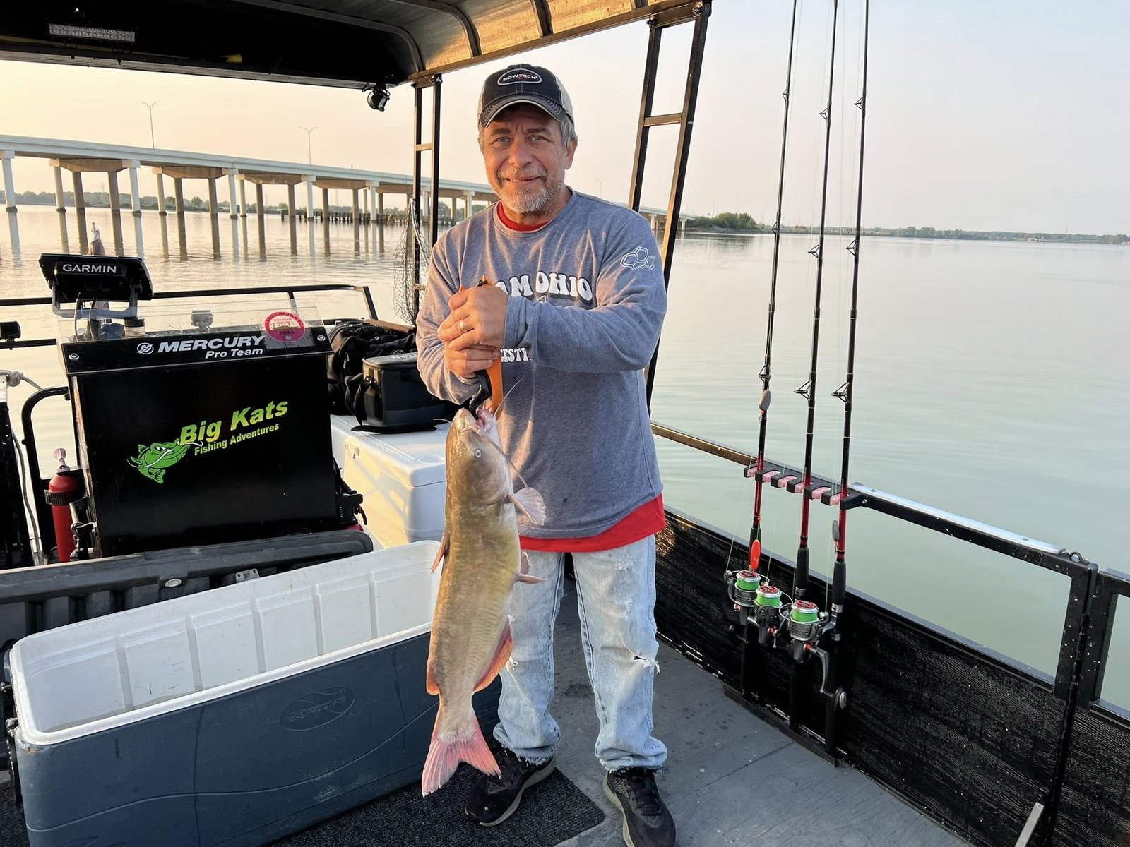 A guide working with a client on the water, photographed by Big Kat's Fishing Adventures in OH