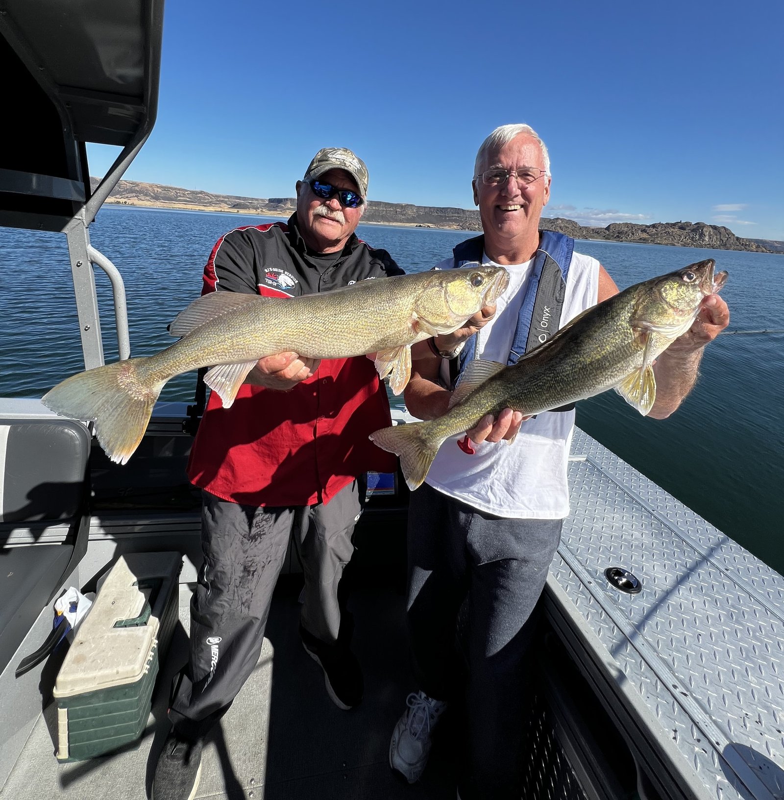 A guide working with a client on the water, photographed by B.J.'s Guide Service in WA
