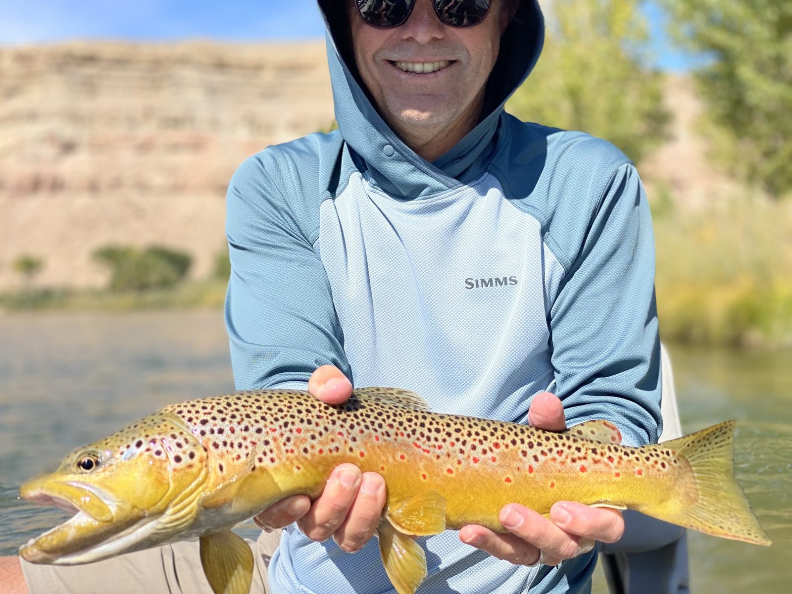 A guide working with a client on the water, photographed by Black Canyon Anglers in CO