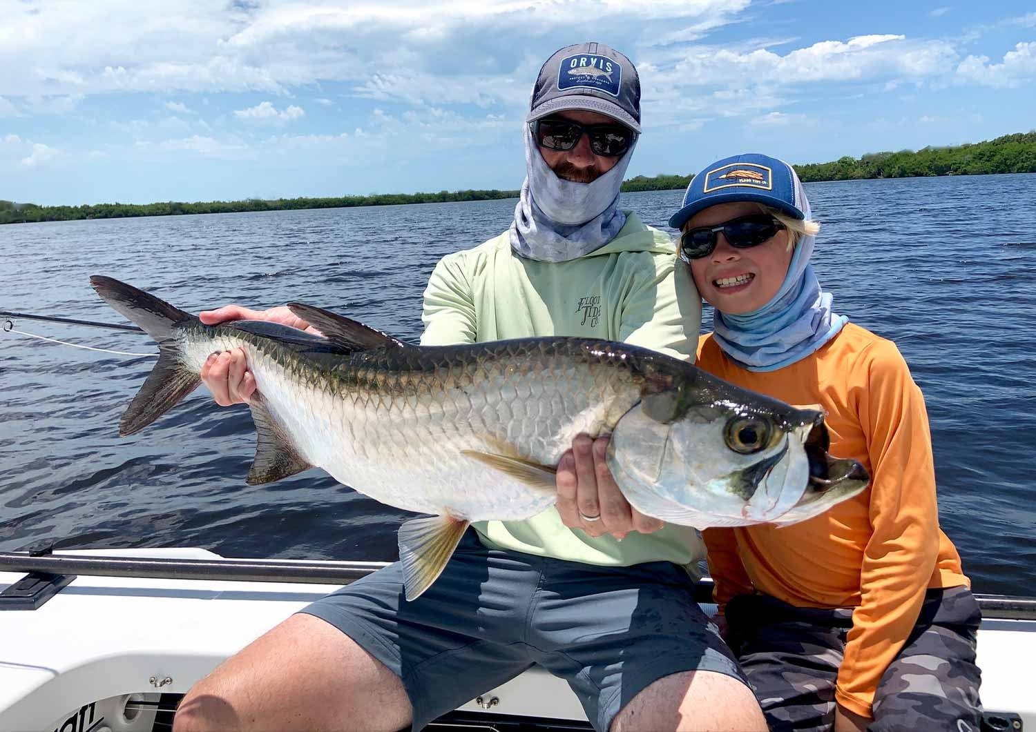A guide working with a client on the water, photographed by Boca Grande Fly Fishing Guide Services in FL