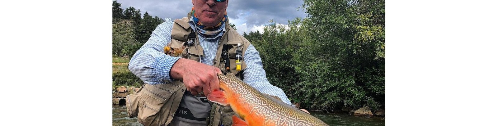A guide working with a client on the water, photographed by Boxwood Gulch Ranch in CO