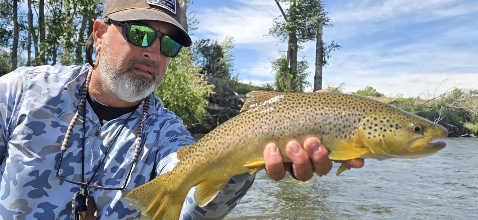 A guide at work during a trip, photographed by Buglife Flyfishing in MT