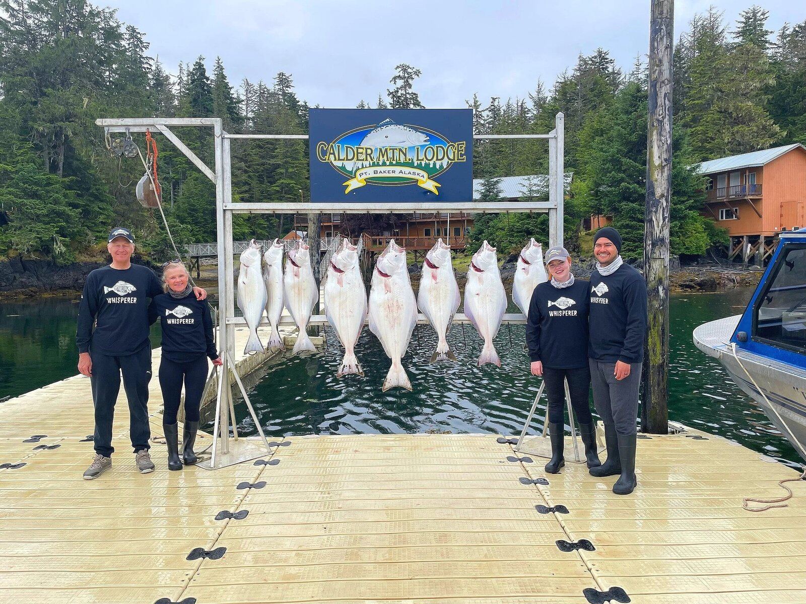 A guide working with a client on the water, photographed by Calder Mountain Lodge in AK