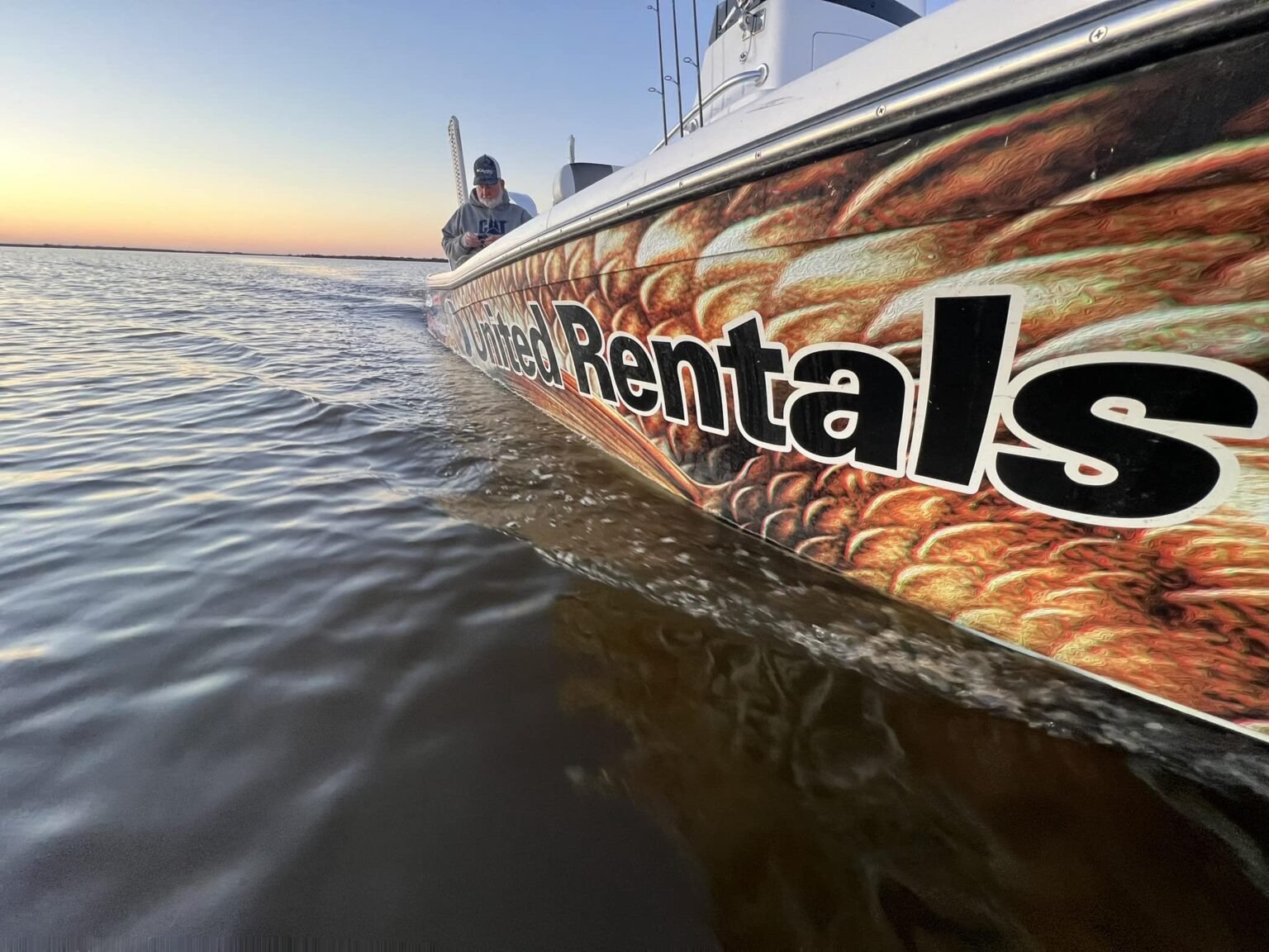 A guide at work during a trip, photographed by Captain Charlie's Bayou Charters in LA