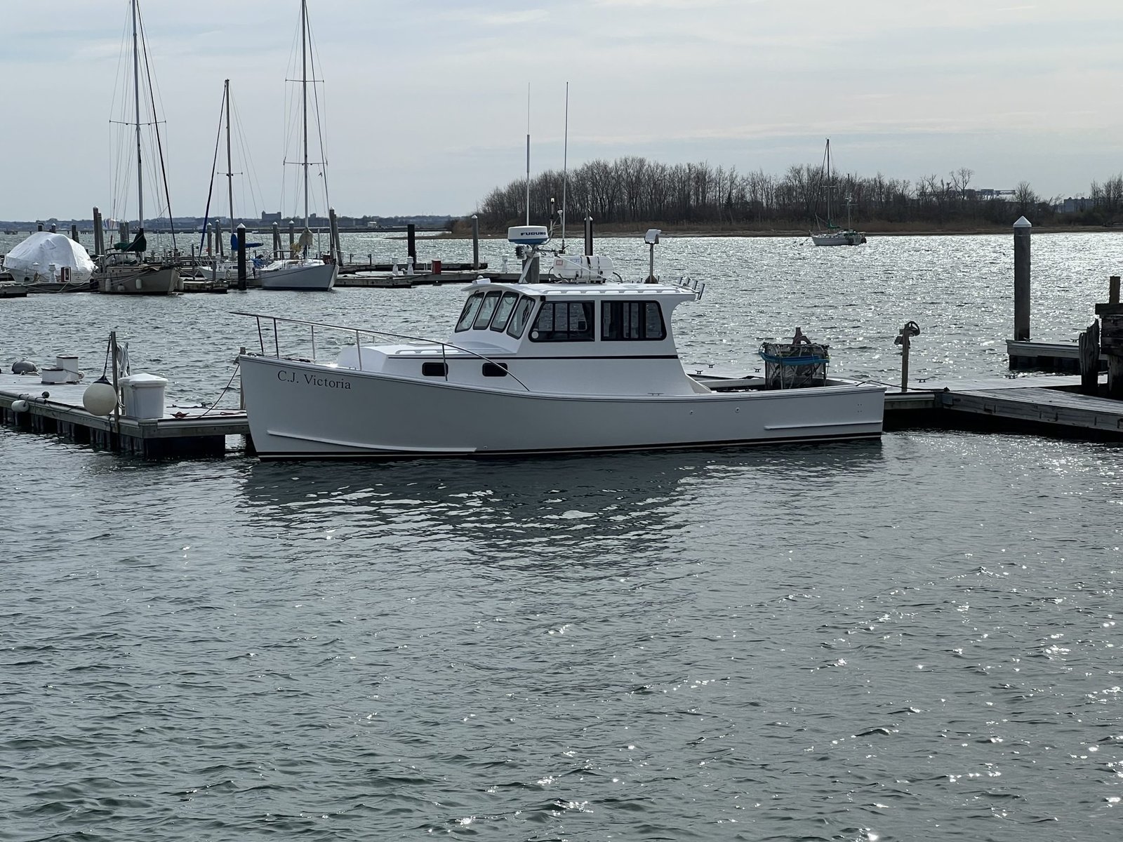 A guide at work during a trip, photographed by C.J. Victoria Fishing Charters in MA