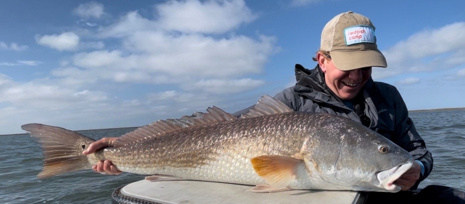 A guide working with a client on the water, photographed by Commer's All Season Anglers in MS