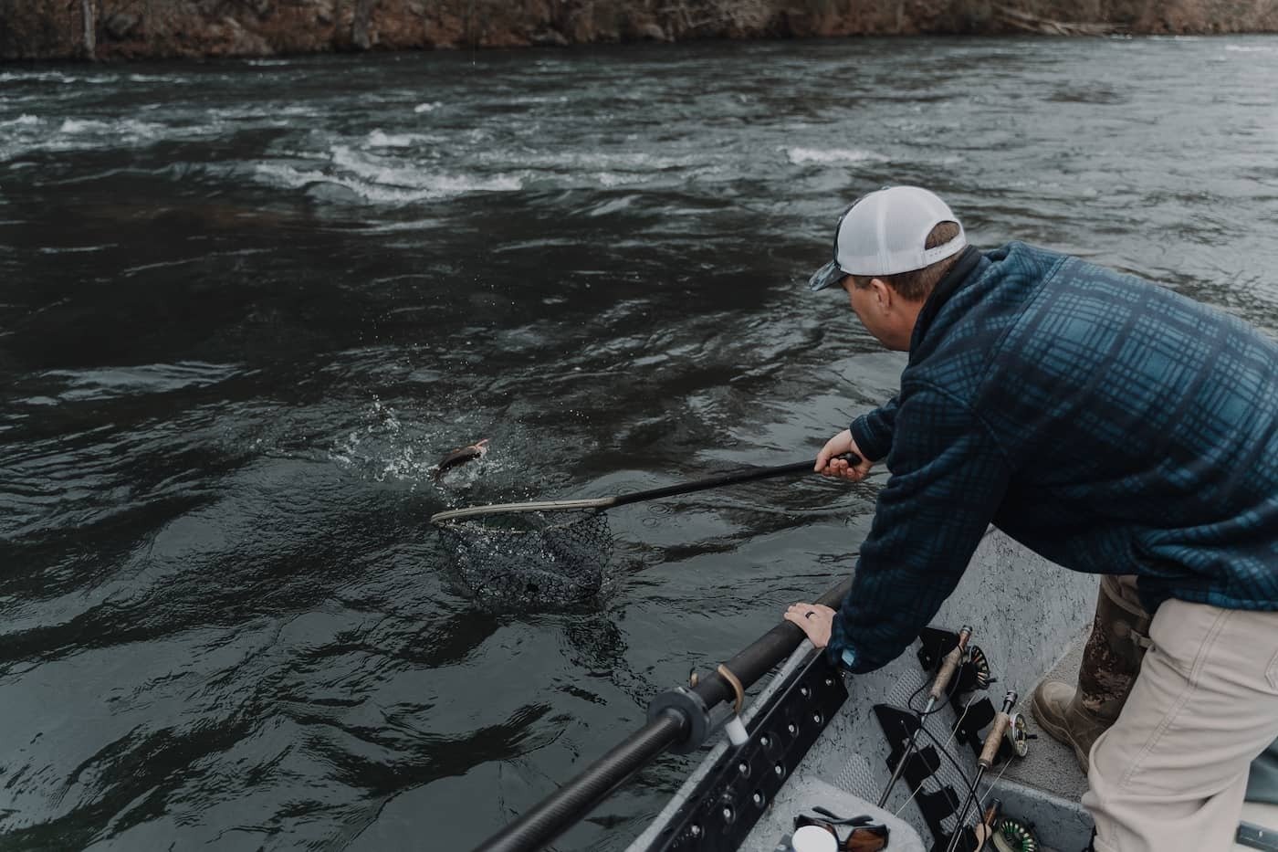 A guide working with a client on the water, photographed by Conrads Guide Service in TN