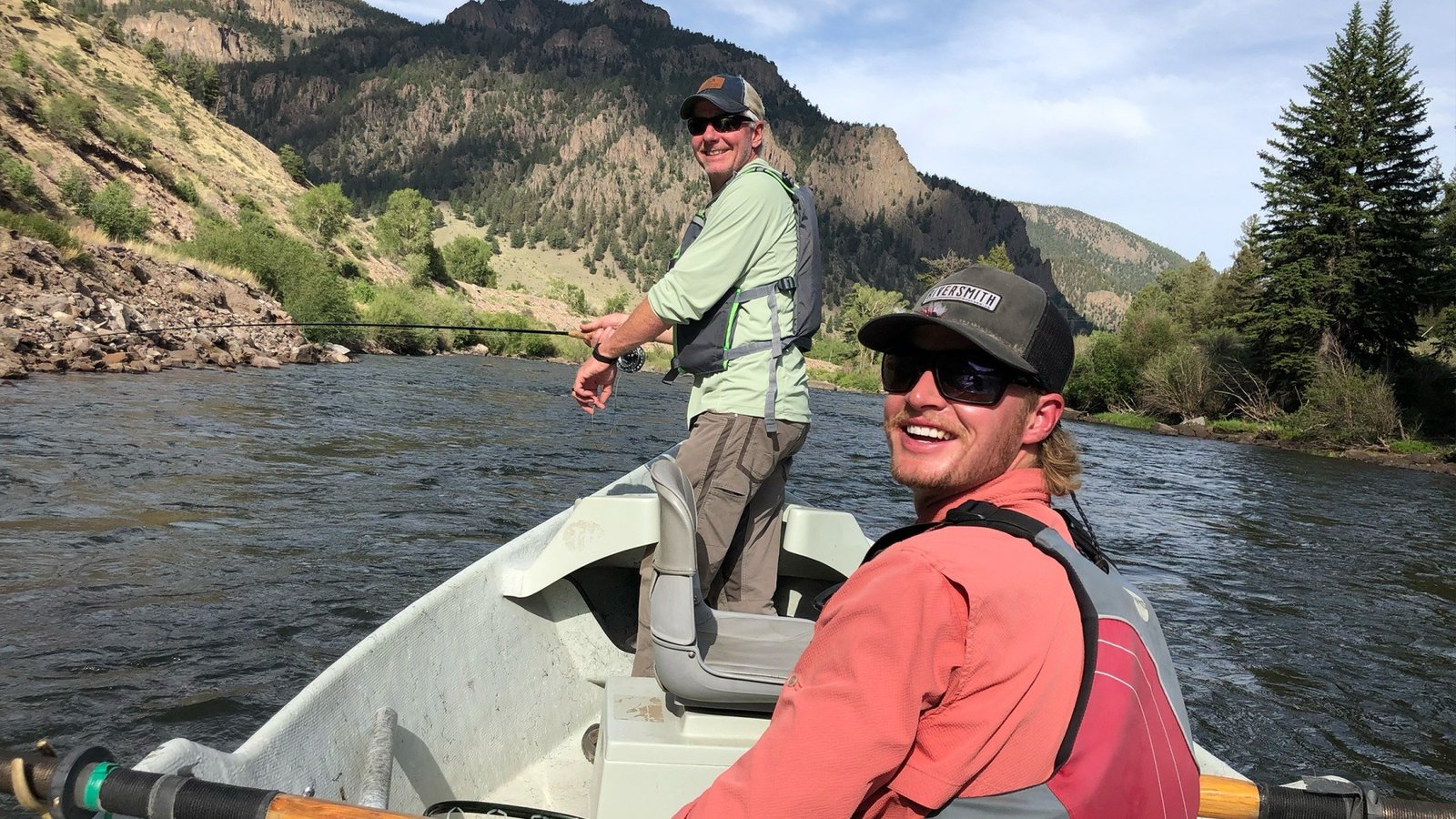 A guide working with a client on the water, photographed by Cut Bank Outfitters in CO