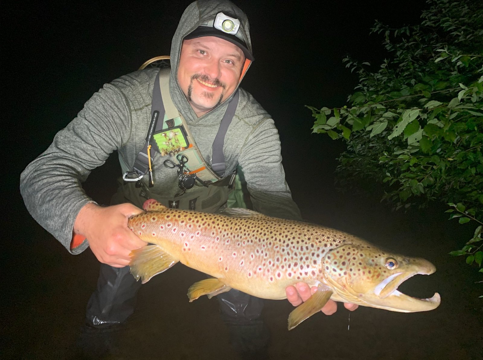 A guide at work during a trip, photographed by Dark Waters Fly Shop and Guide Service in MI