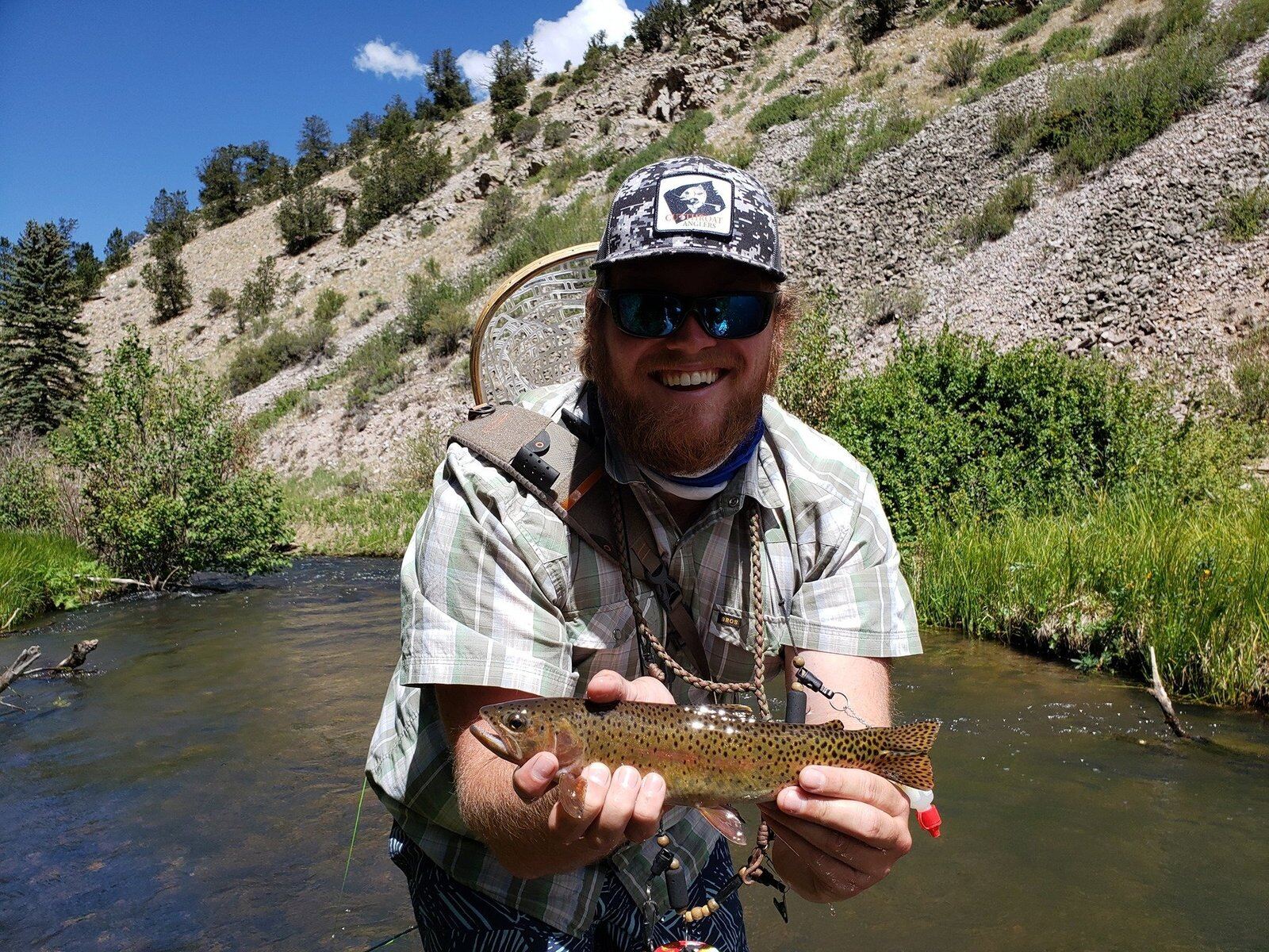 A guide working with a client on the water, photographed by Dos Amigos Fly Shop and Tackle in NM