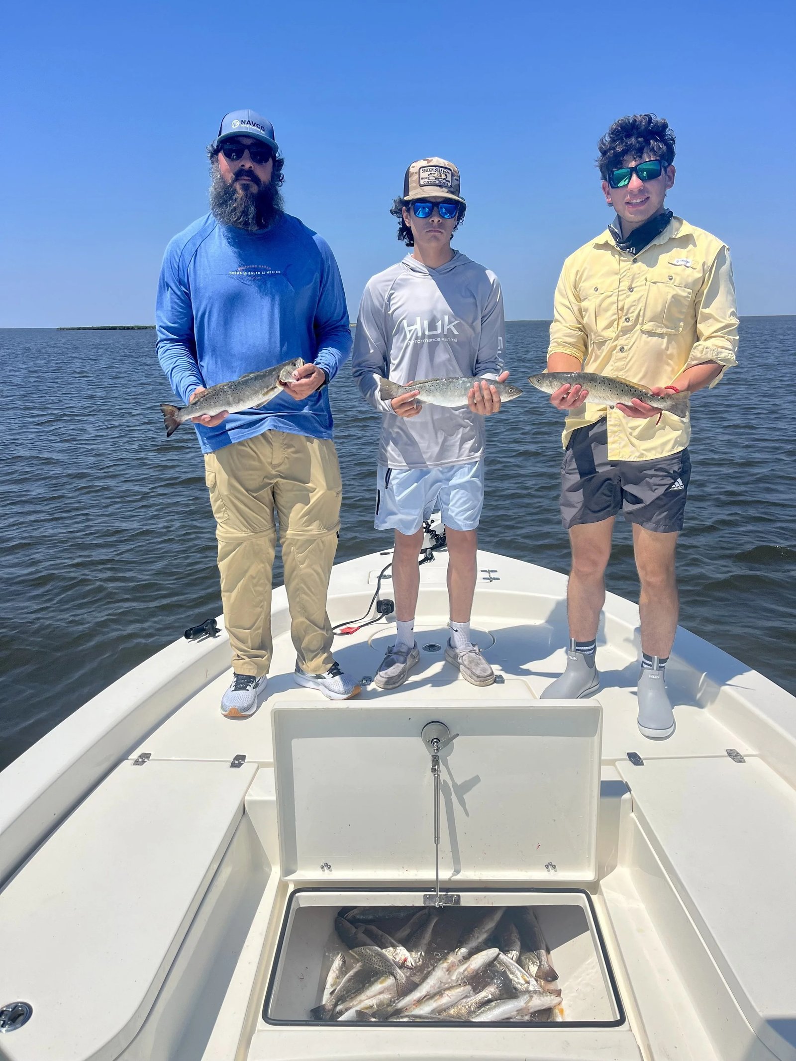 A guide working with a client on the water, photographed by Du South Fishing Charters, LLC in LA