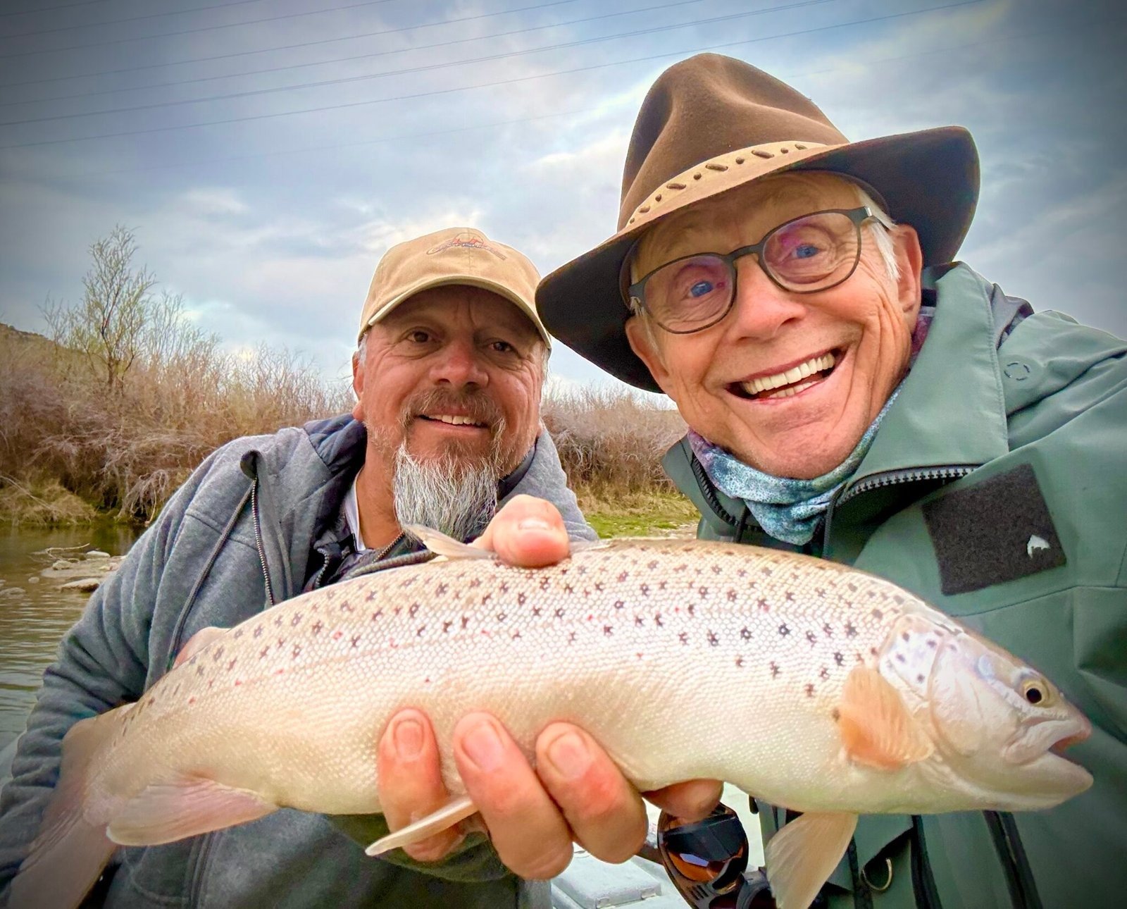 A guide working with a client on the water, photographed by Elite Fly Fishing in NM