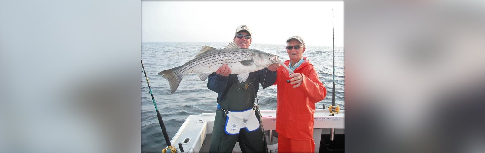 An on-the-water scene from a working guide operation, photographed by Elizabeth Marie Sport Fishing in MA