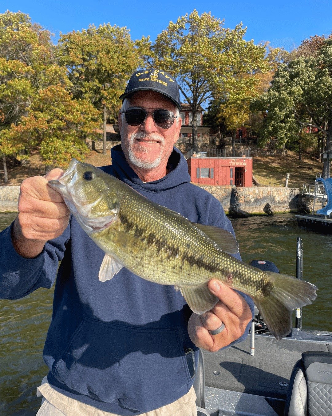 A guide working with a client on the water, photographed by Expert Angling Guide Service in MO