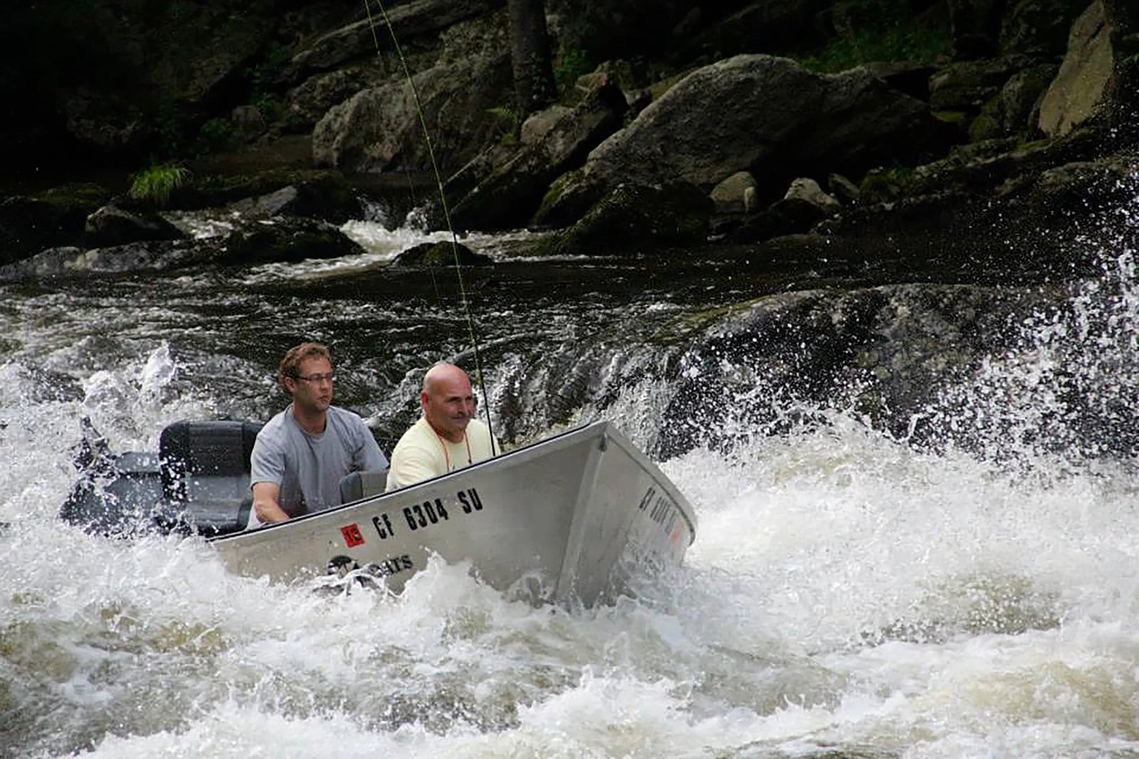 A guide working with a client on the water, photographed by Farmington River Trading Company in CT