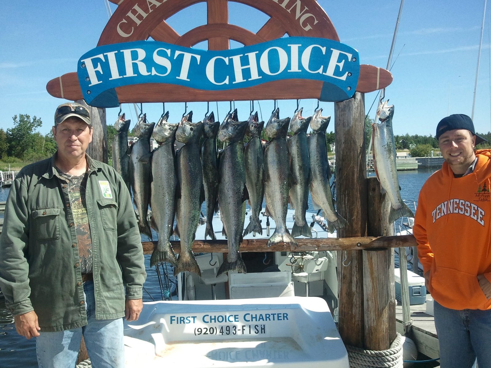 A guide working with a client on the water, photographed by First Choice Charter Fishing in WI