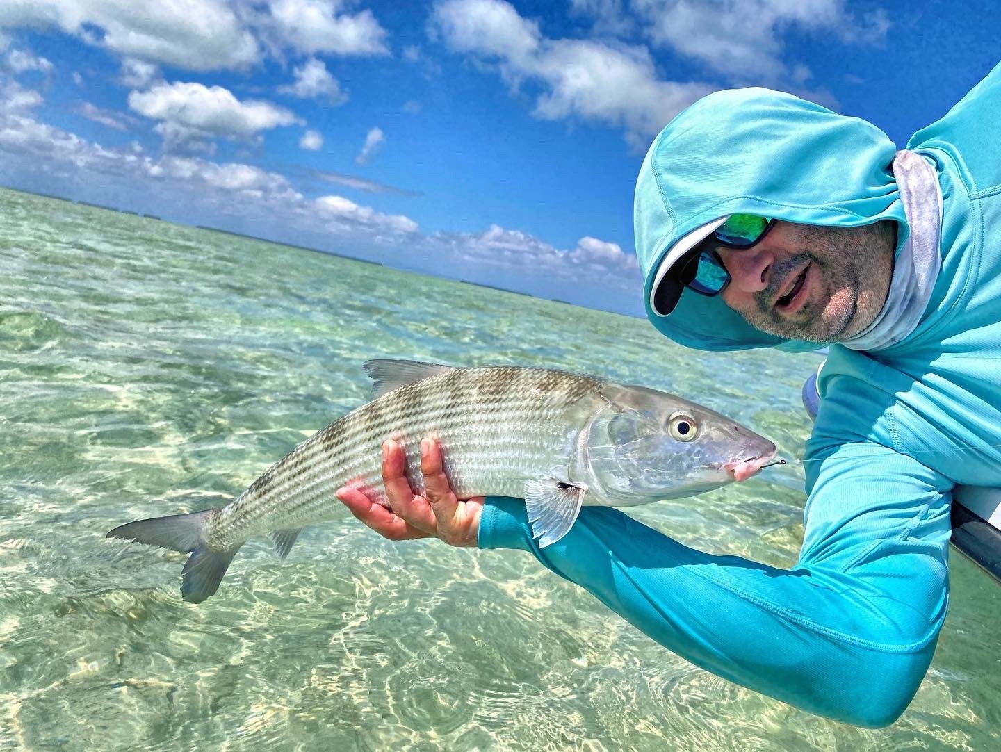 An angler fishing under a guide's direction, photographed by Fly Fish Miami in FL
