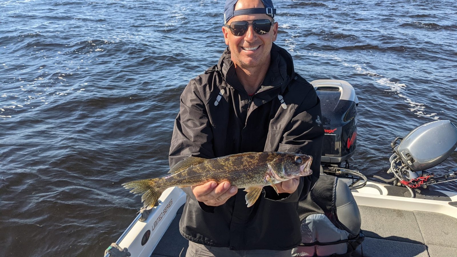 A guide working with a client on the water, photographed by Forcier's Fishing Guide Service, LLC in WI