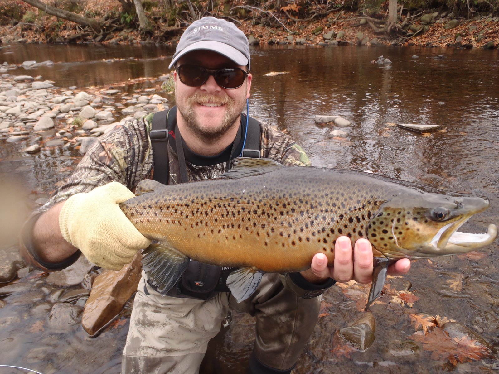 A guide working with a client on the water, photographed by Great Drake Angling & Outdoor Adventures in VT