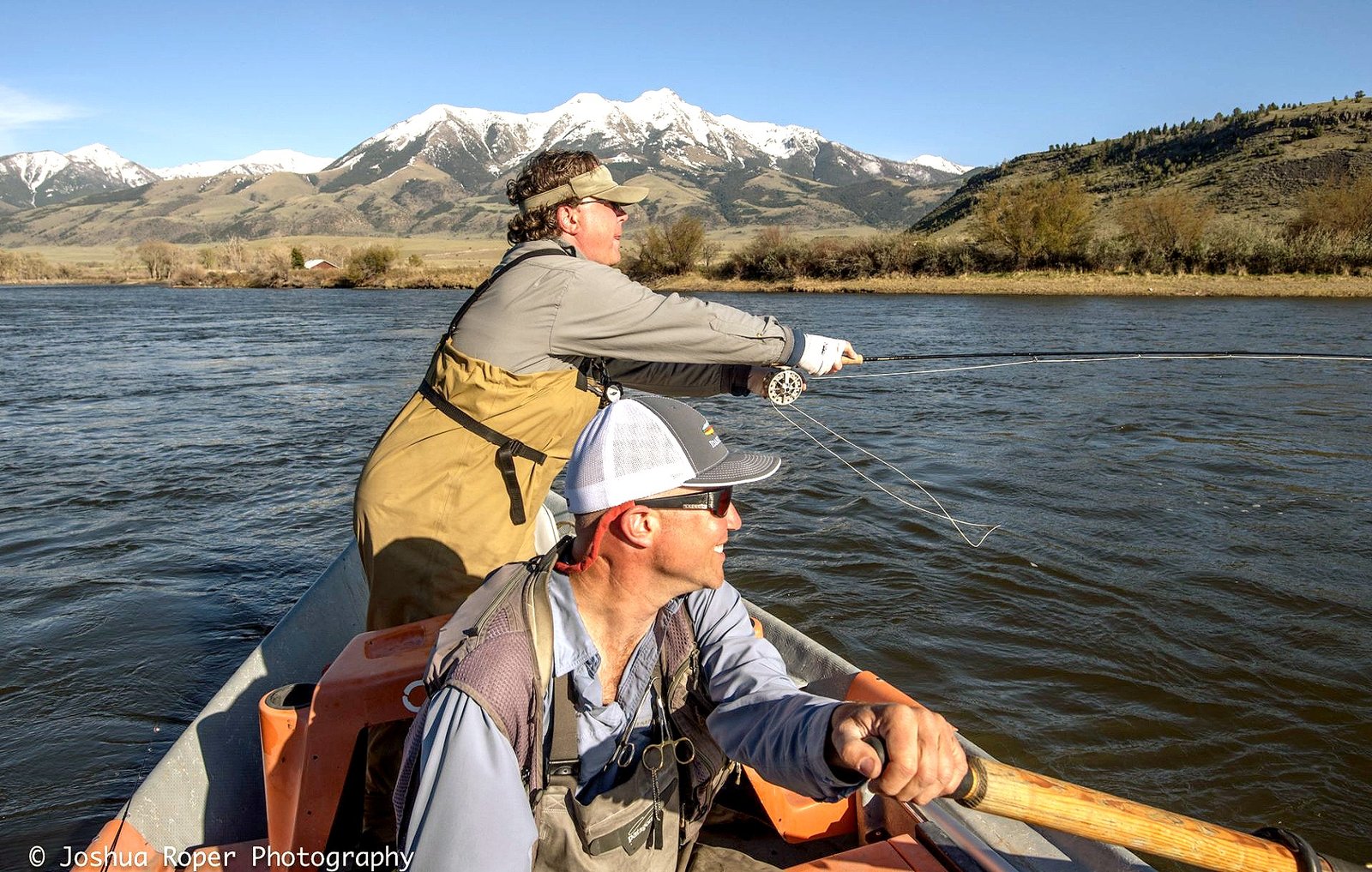 A guide working with a client on the water, photographed by Greater Yellowstone Outfitters in MT