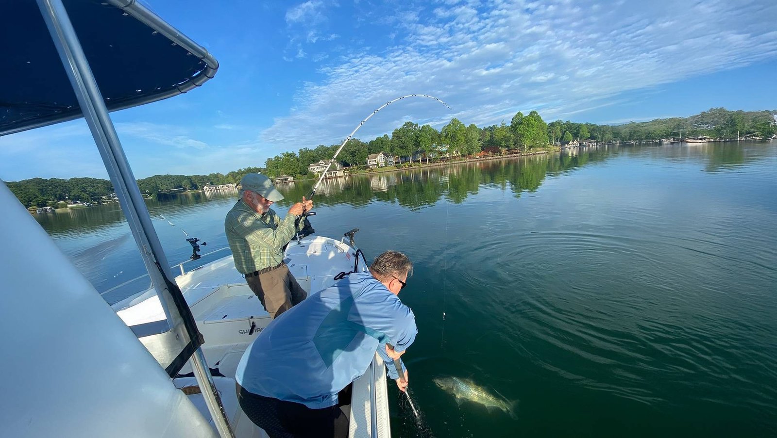 A guide working with a client on the water, photographed by Hartman Guide Services in VA