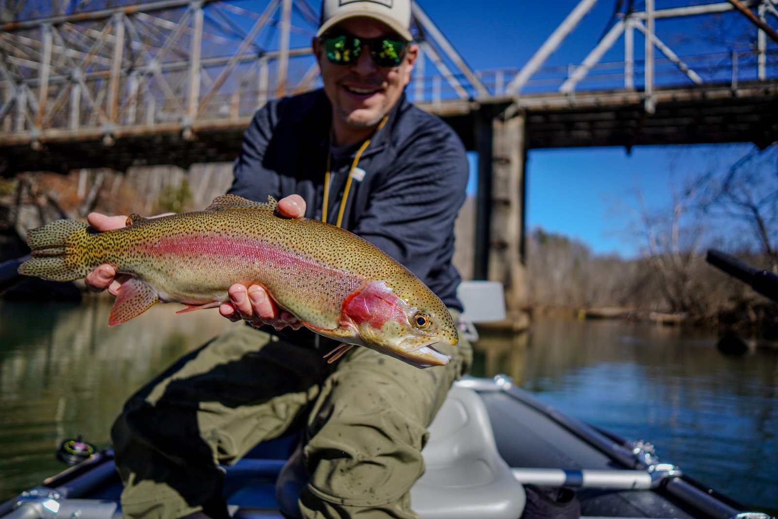 A guide working with a client on the water, photographed by High Flying Flies Guide Service in TN