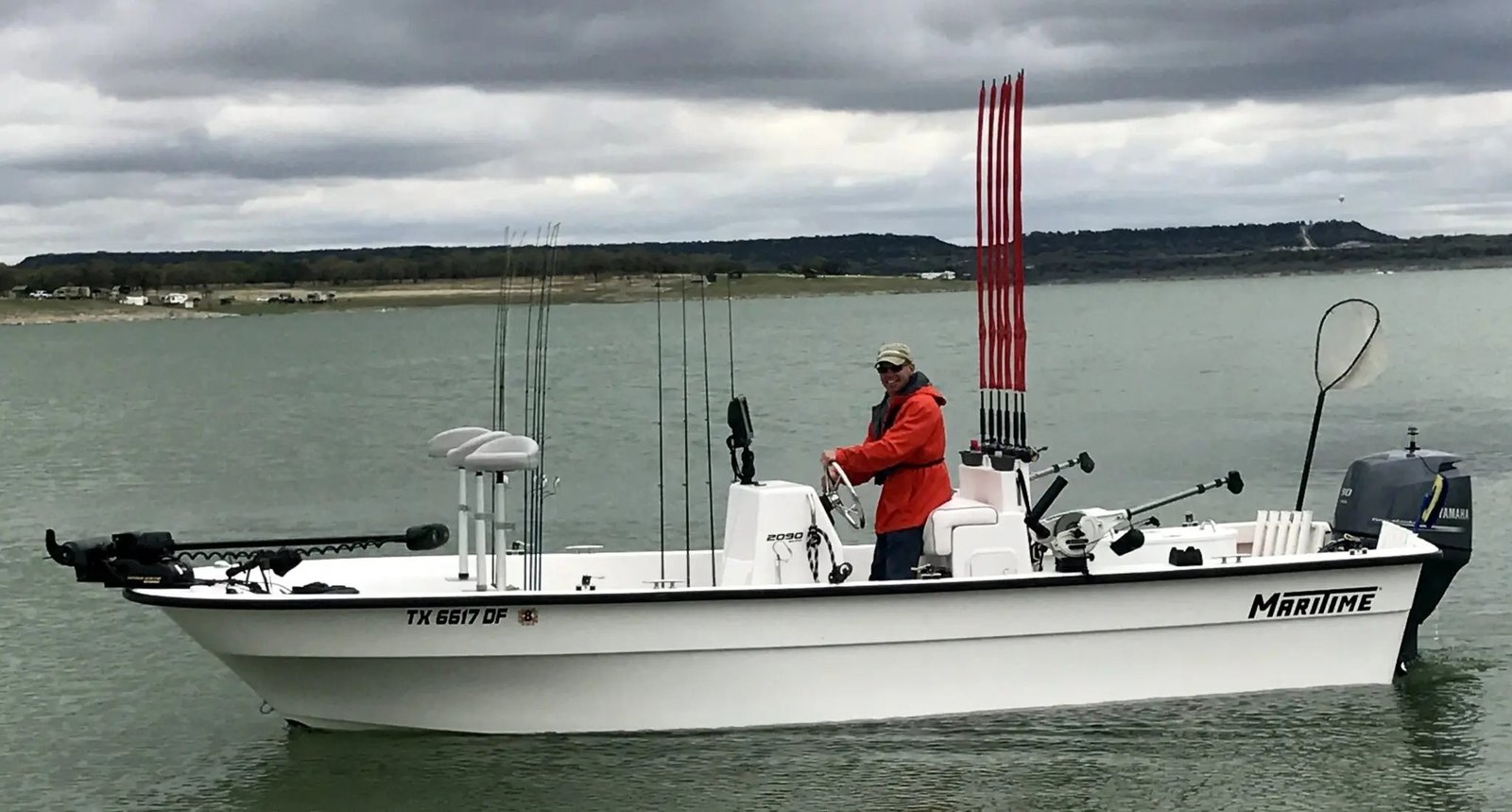 A guide working with a client on the water, photographed by Holding the Line Guide Service in TX