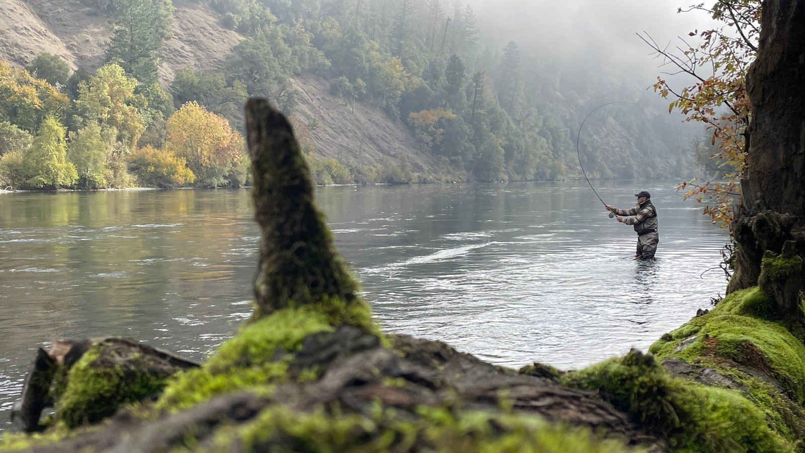 A guide working with a client on the water, photographed by Humble Heron Fly Fishing in OR