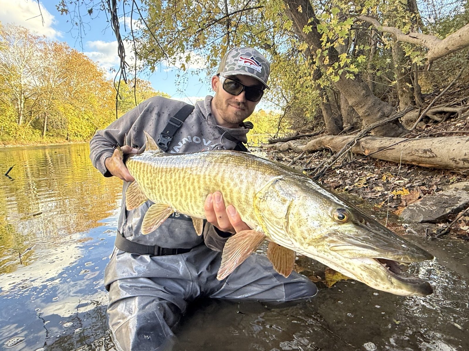 A guide working with a client on the water, photographed by Innovative Angling in PA