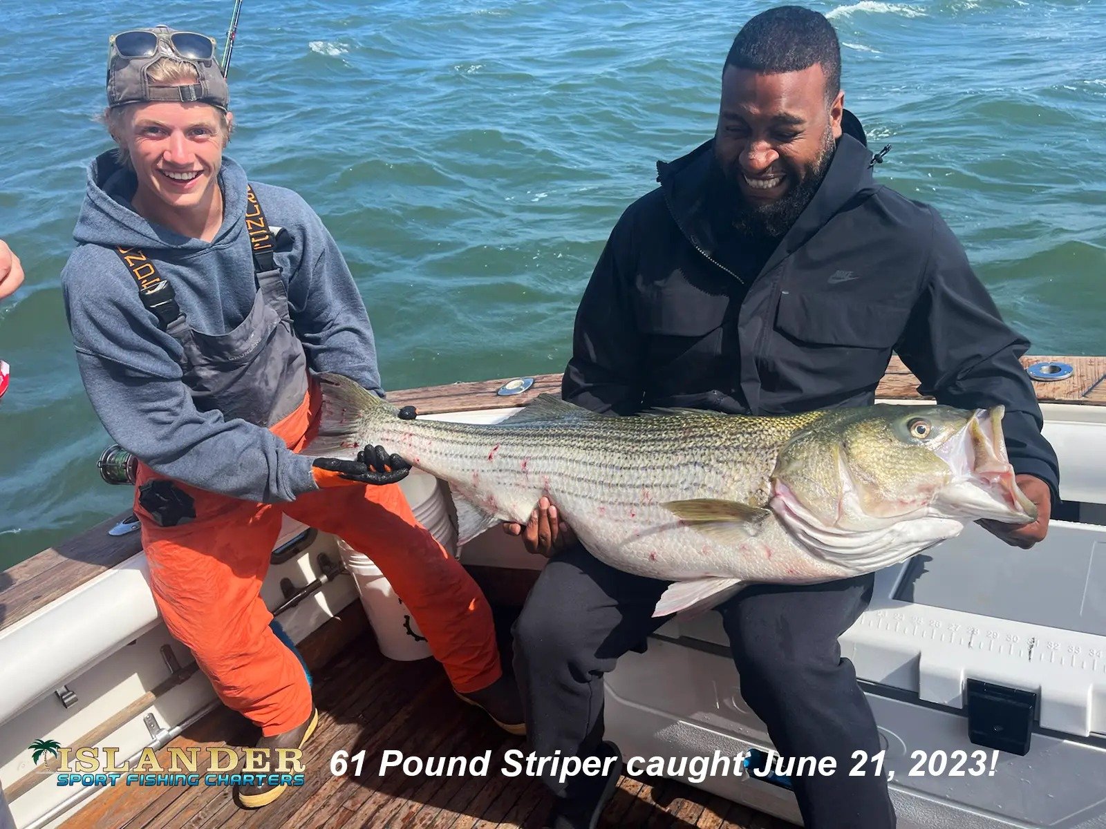 A guide working with a client on the water, photographed by Islander Sport Fishing Charters in CT