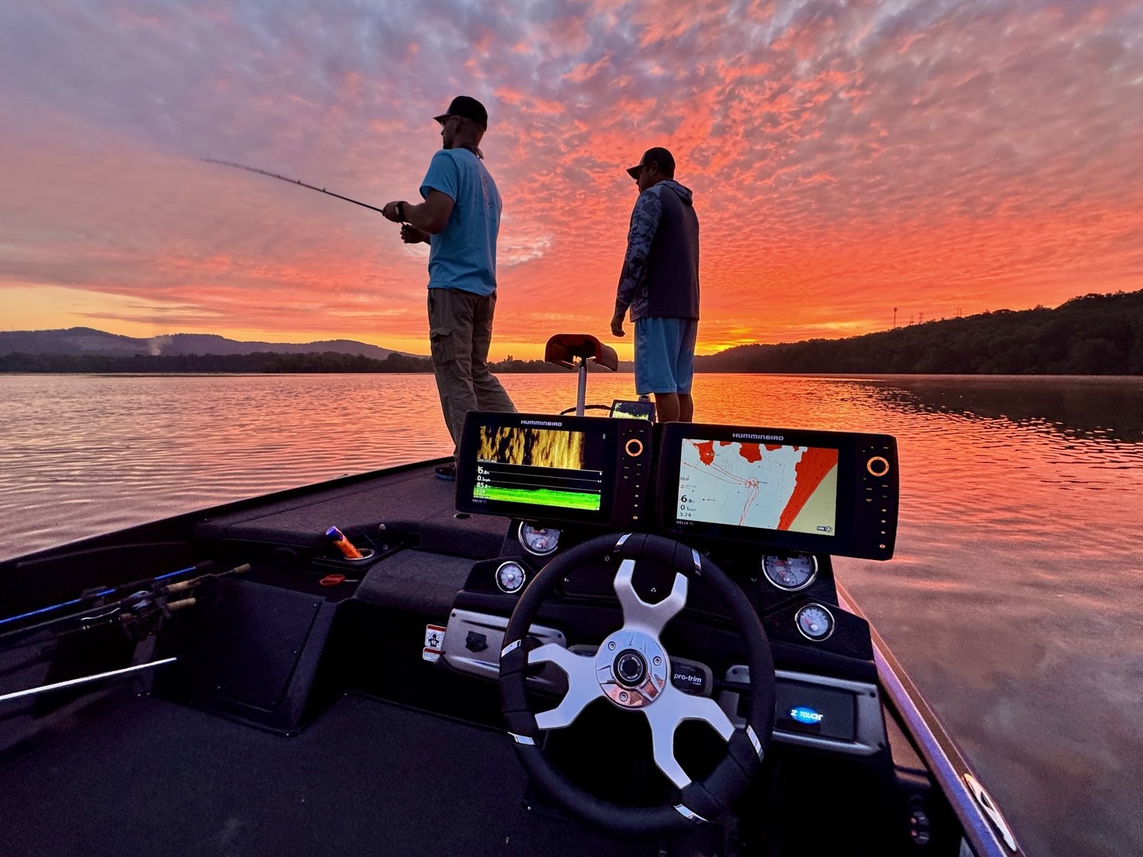 A guide working with a client on the water, photographed by Jason Miller Guide Service in AL
