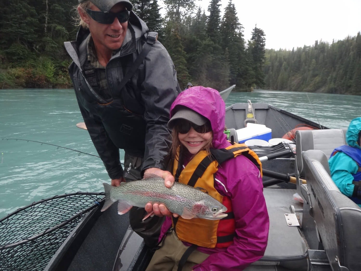 A guide working with a client on the water, photographed by Kenai River Float-n-Fish in AK