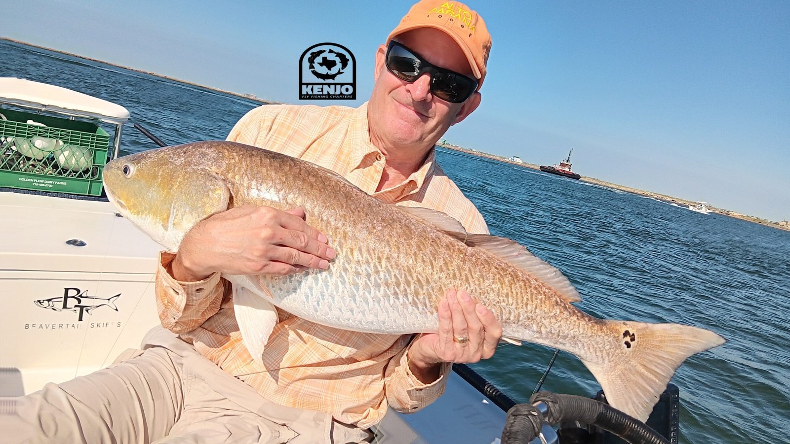 A guide working with a client on the water, photographed by Kenjo Fly Fishing in TX