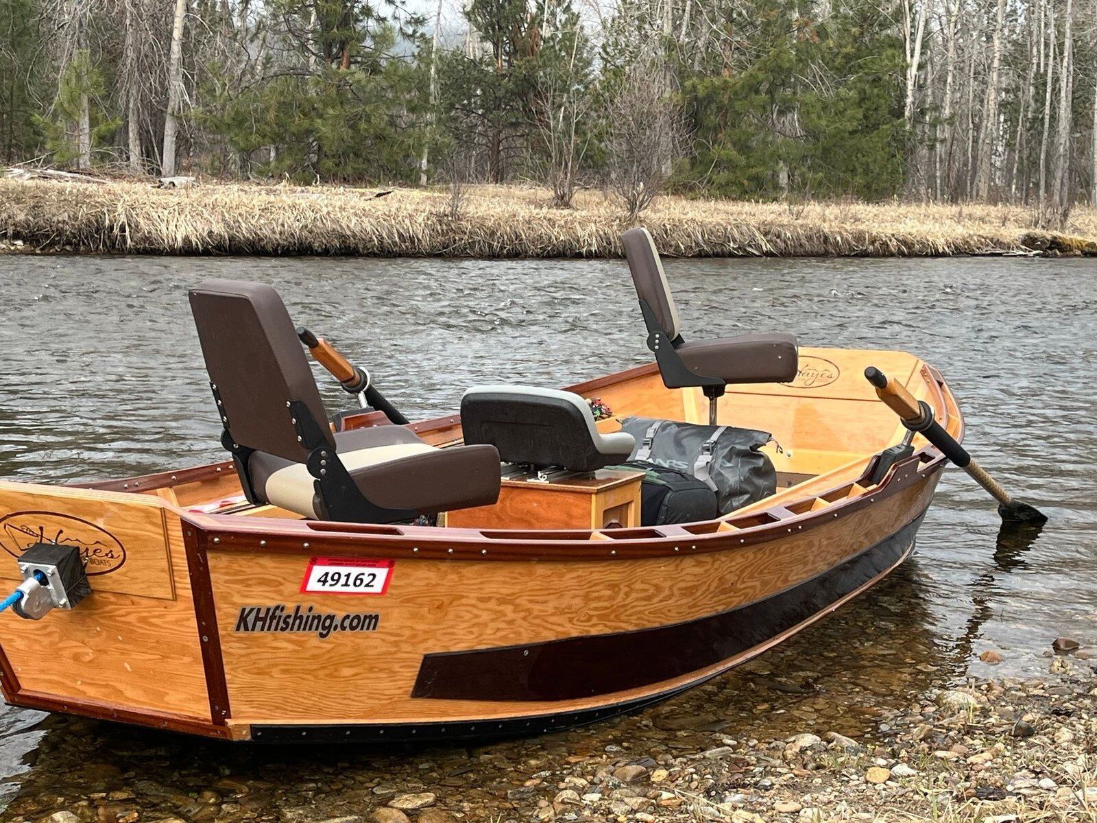 A guide working with a client on the water, photographed by Kevin Hawkins Fishing in MT