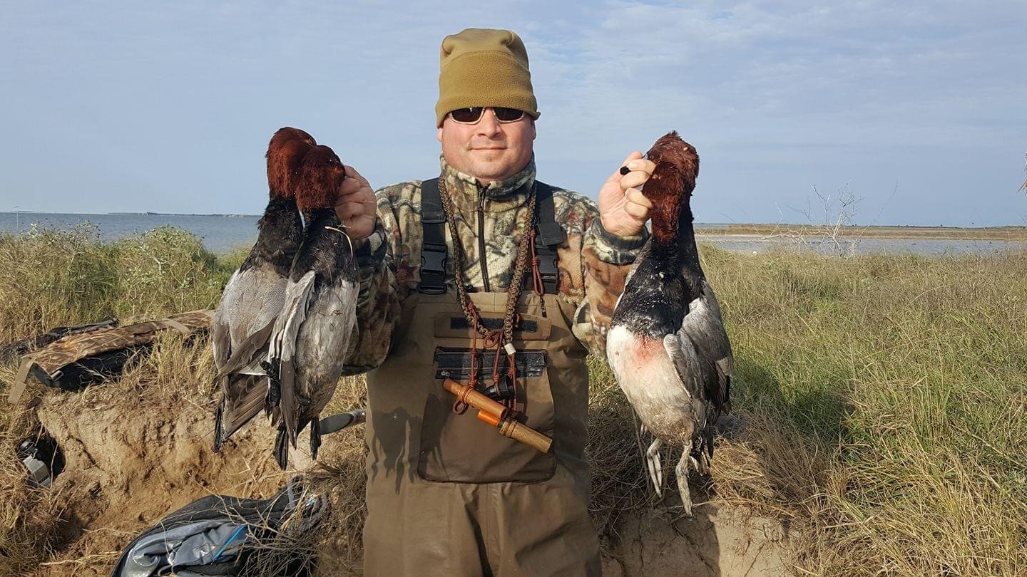 A guide working with a client on the water, photographed by Laguna Madre Guide Service in TX