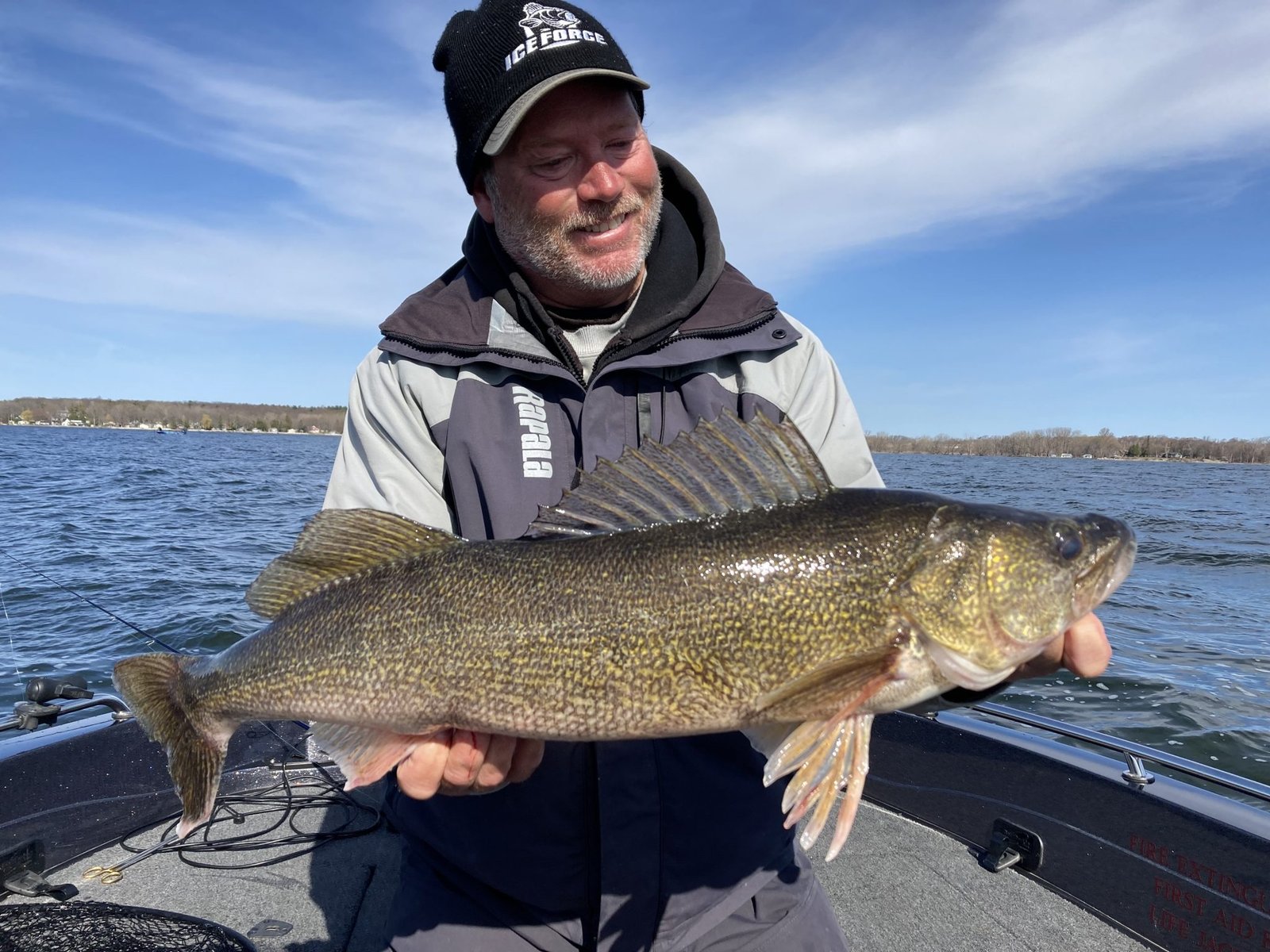A guide working with a client on the water, photographed by Late Eyes Sport Fishing Guide Service in WI