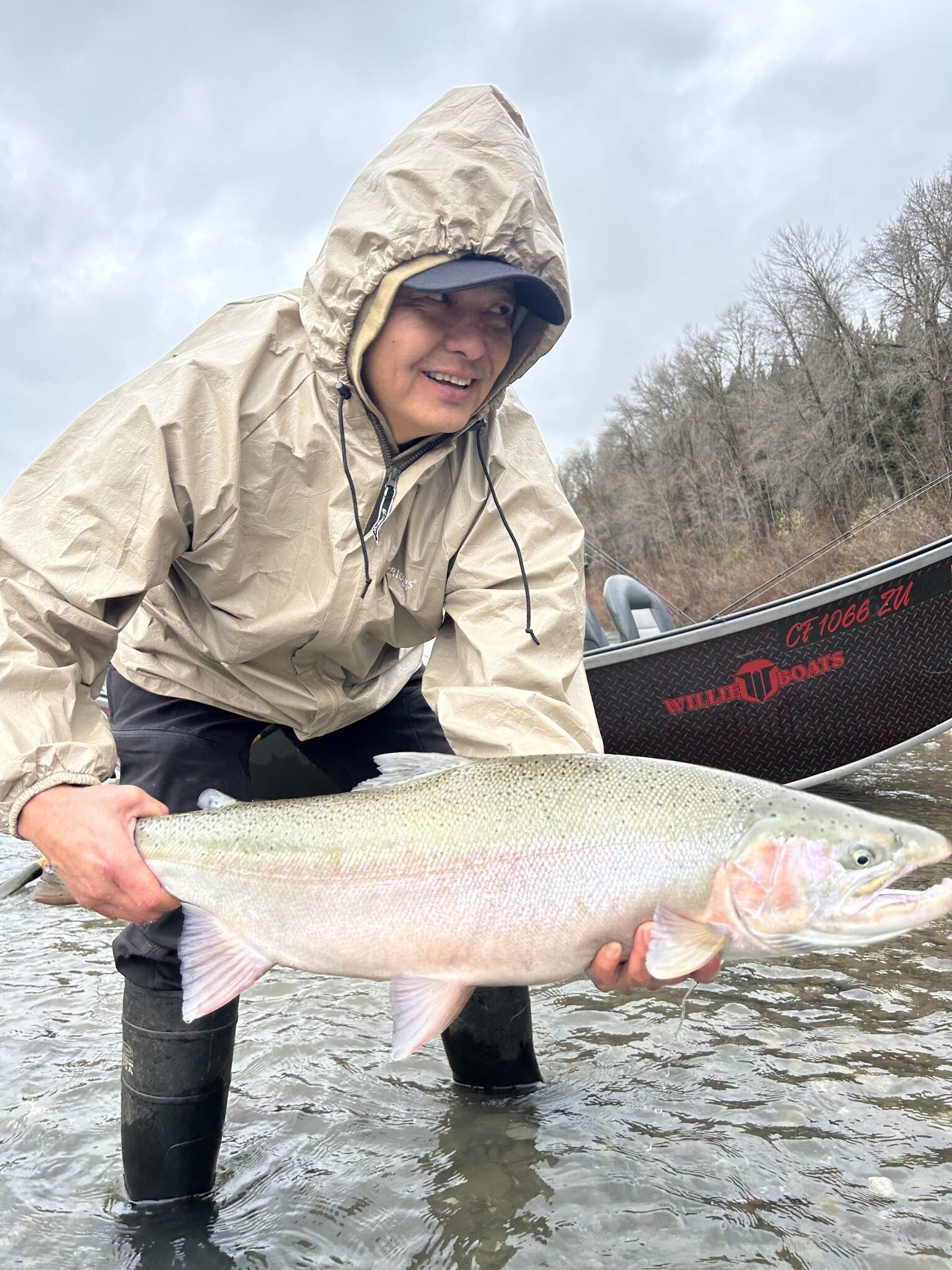 A guide working with a client on the water, photographed by Lost Coast Sport Fishing in CA