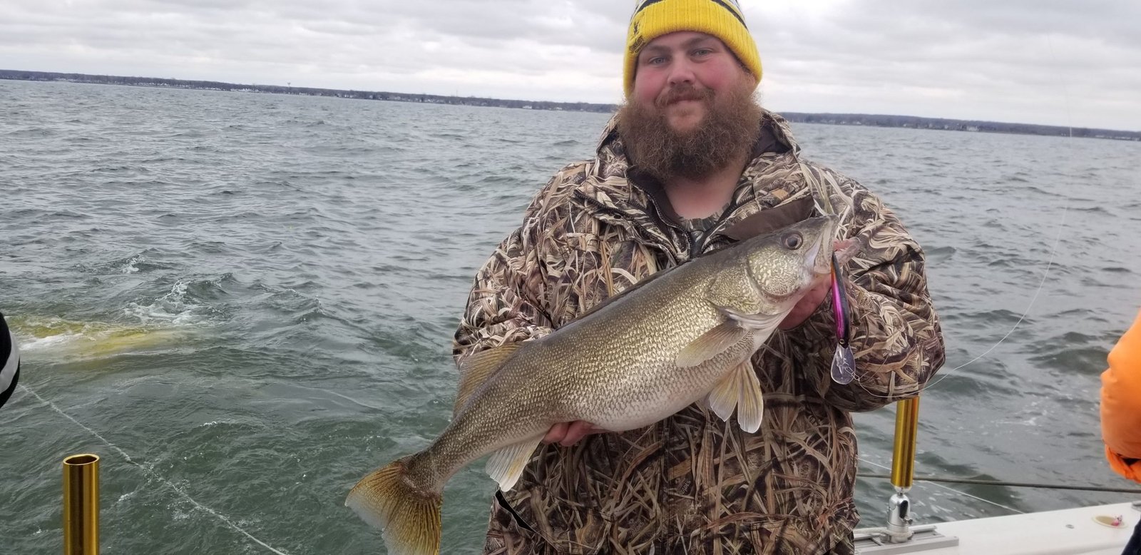 A guide working with a client on the water, photographed by Mark 1 Sportfishing in OH