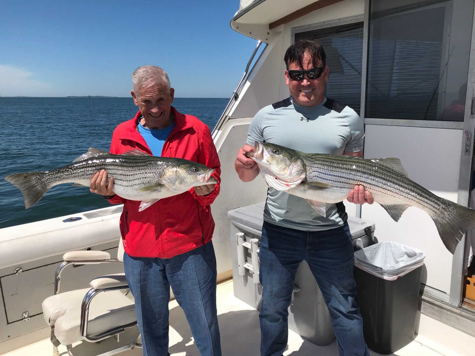 A guide working with a client on the water, photographed by Marlintini Sportfishing in CT