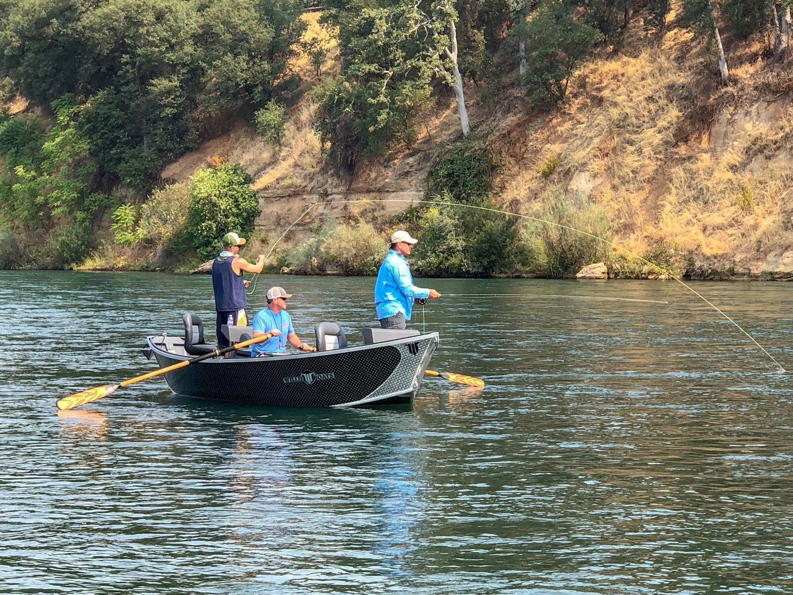 A guide at work during a trip, photographed by Mike Hibbard Fly Fishing in CA