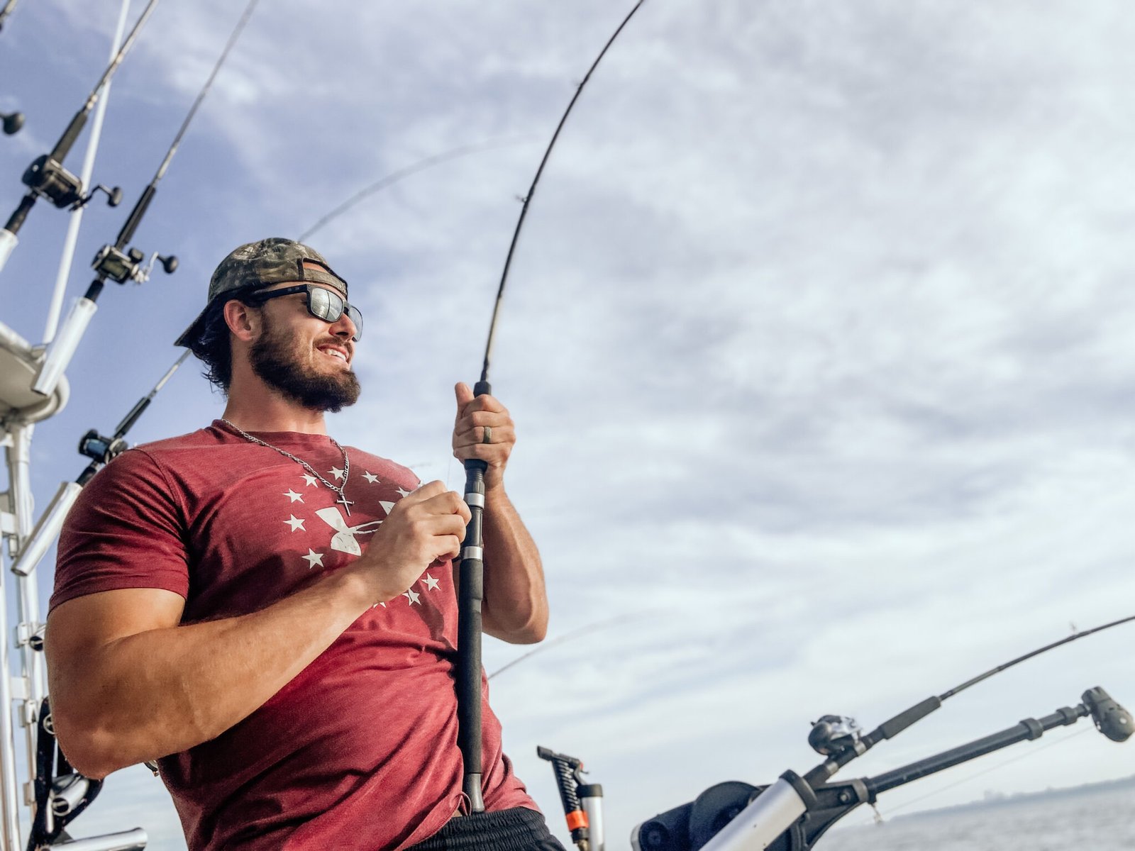 A guide working with a client on the water, photographed by Milwaukee Offshore Fishing Charters in WI