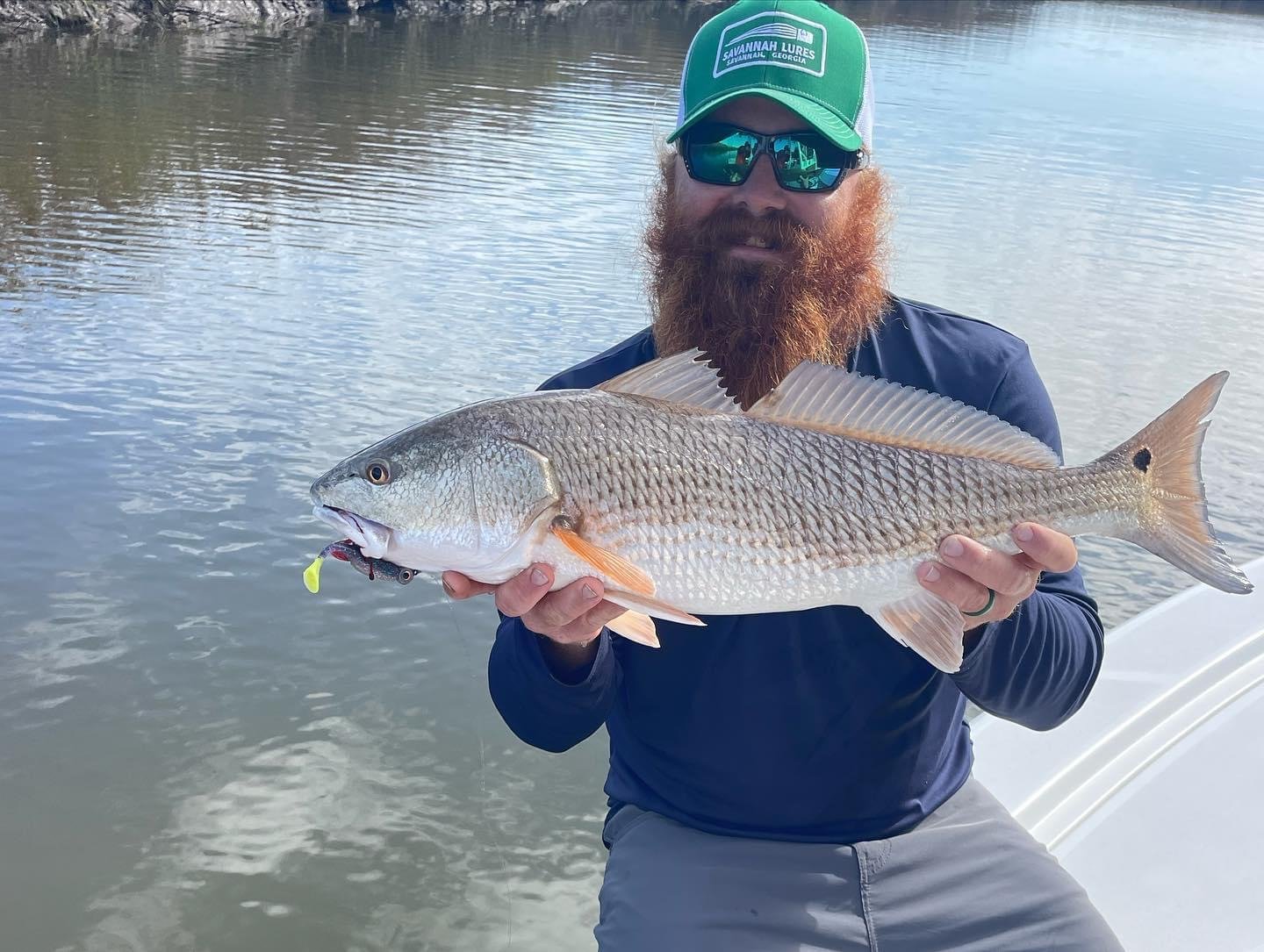 A guide working with a client on the water, photographed by Miss Judy Charters in GA