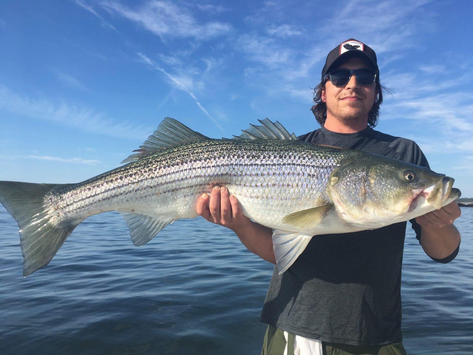 A guide at work during a trip, photographed by No Slack! Sportfishing Charters in ME