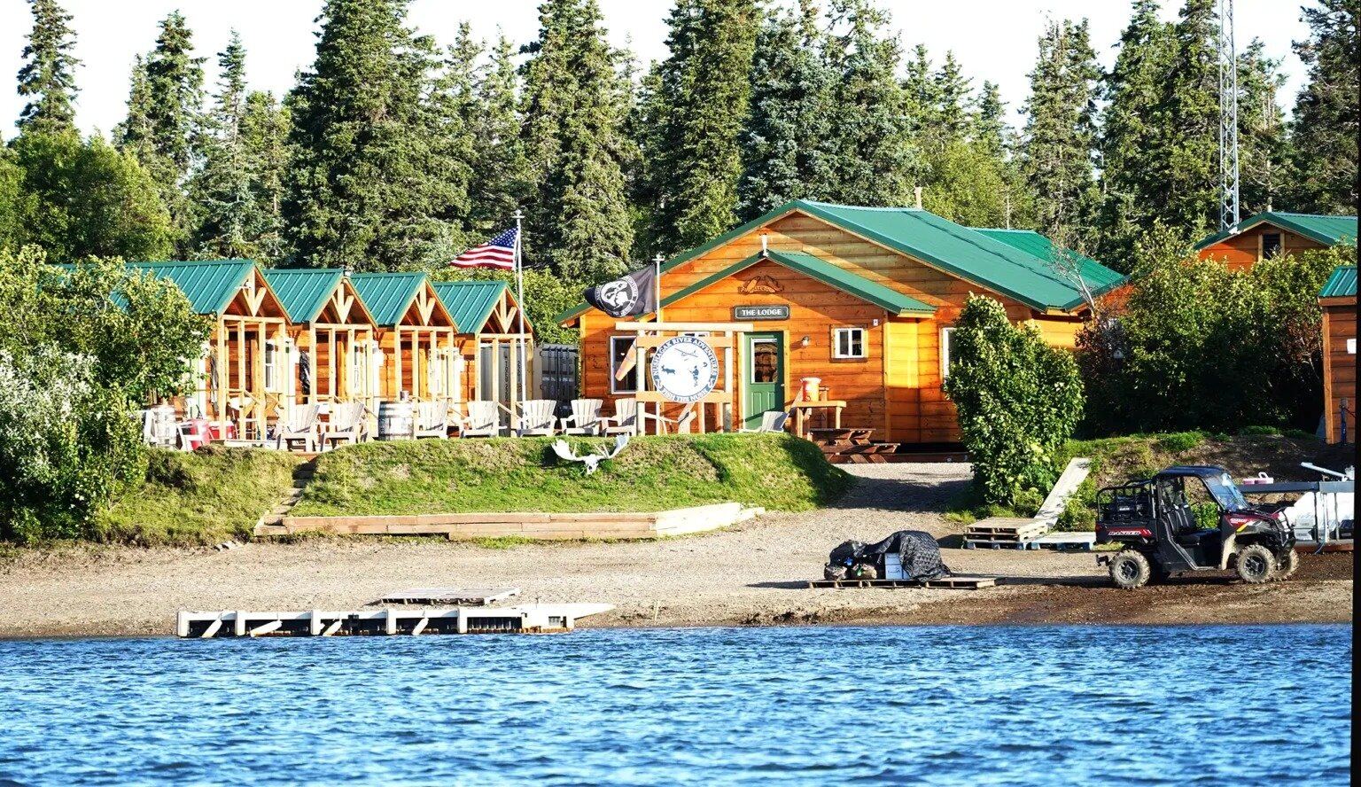 A guide working with a client on the water, photographed by Nushagak River Adventures Lodge in AK