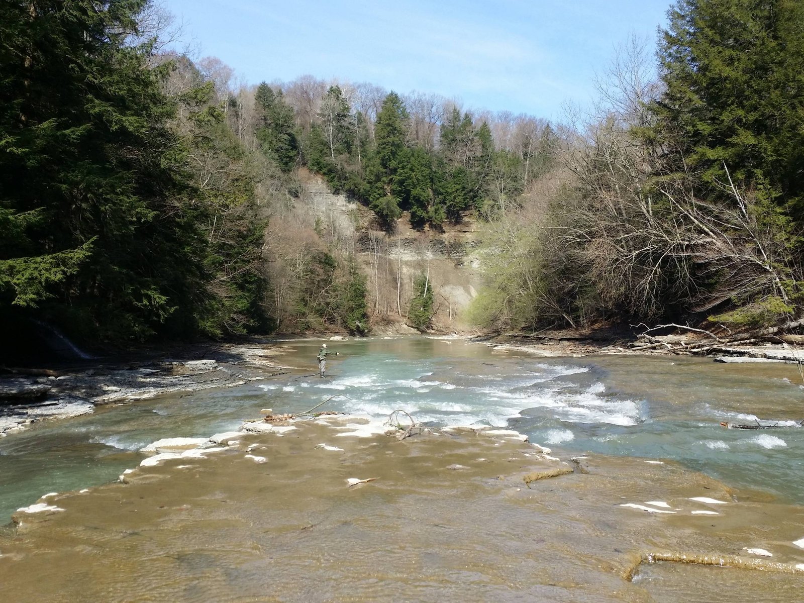 A guide working with a client on the water, photographed by Ontario Fly Outfitters in NY