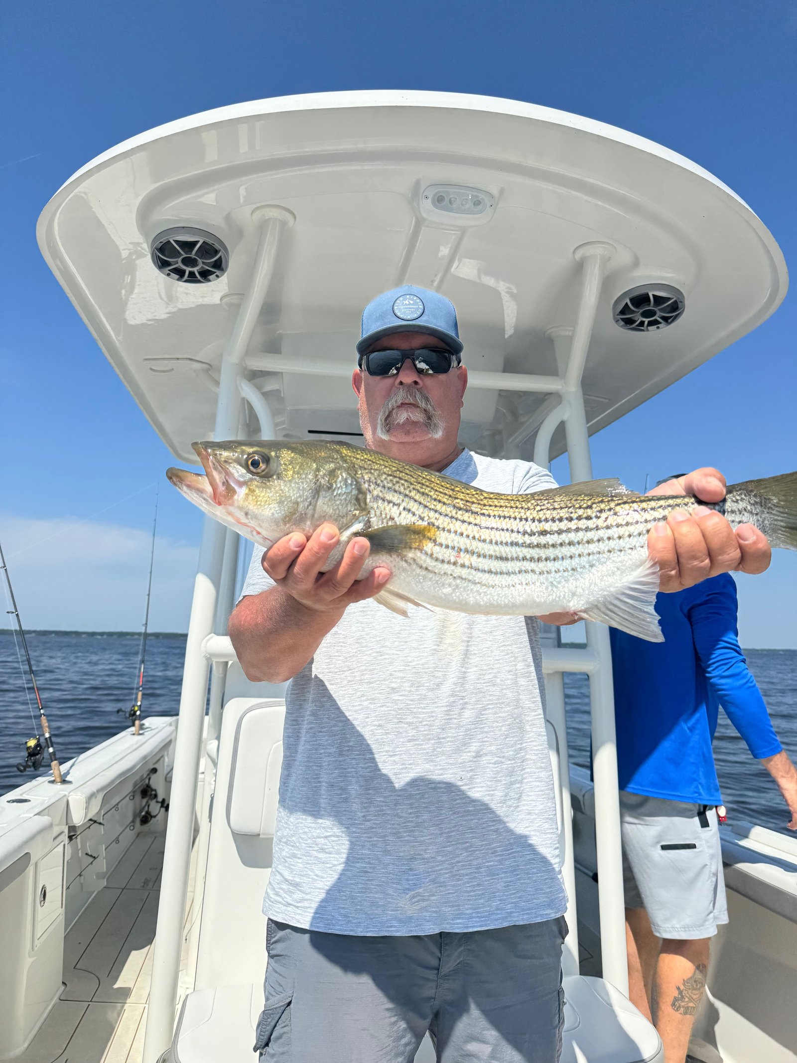 A guide at work during a trip, photographed by Pamlico Pirate Fishing Charters in NC