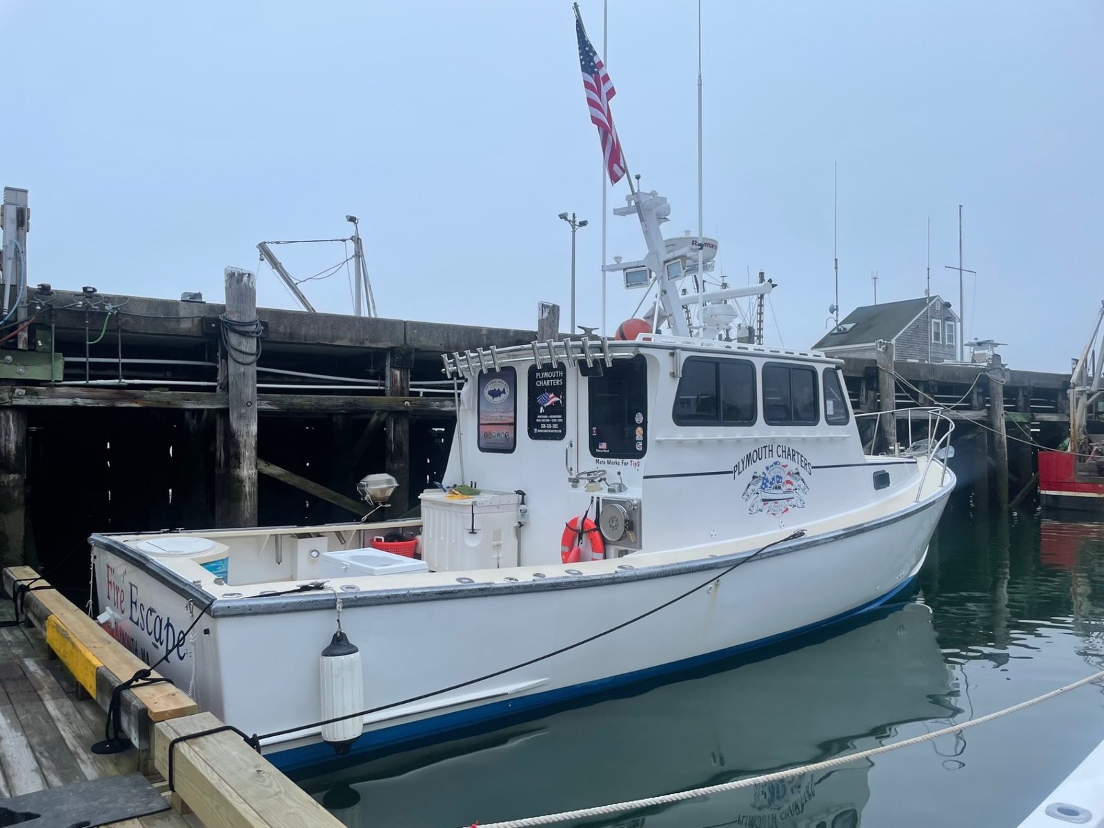 A guide working with a client on the water, photographed by Plymouth Charters in MA